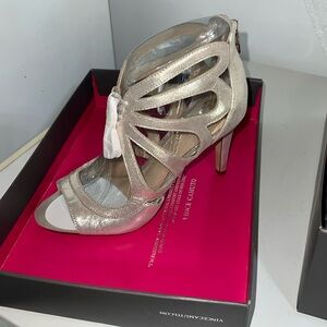 Brand new, still in box Womens Vince Camuto shoes. Size 8. Gold color